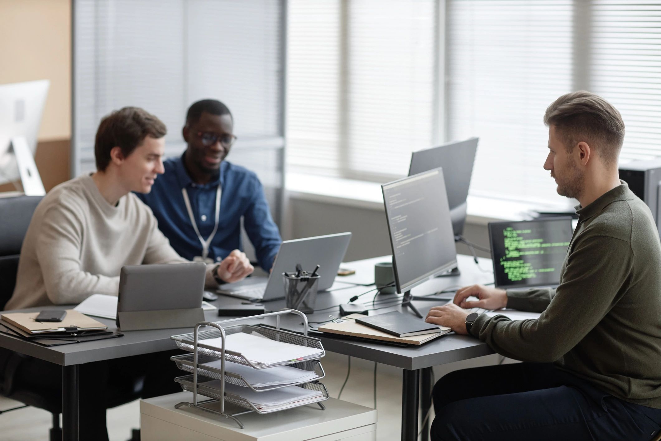 Enterprise IT professionals collaborating in an office