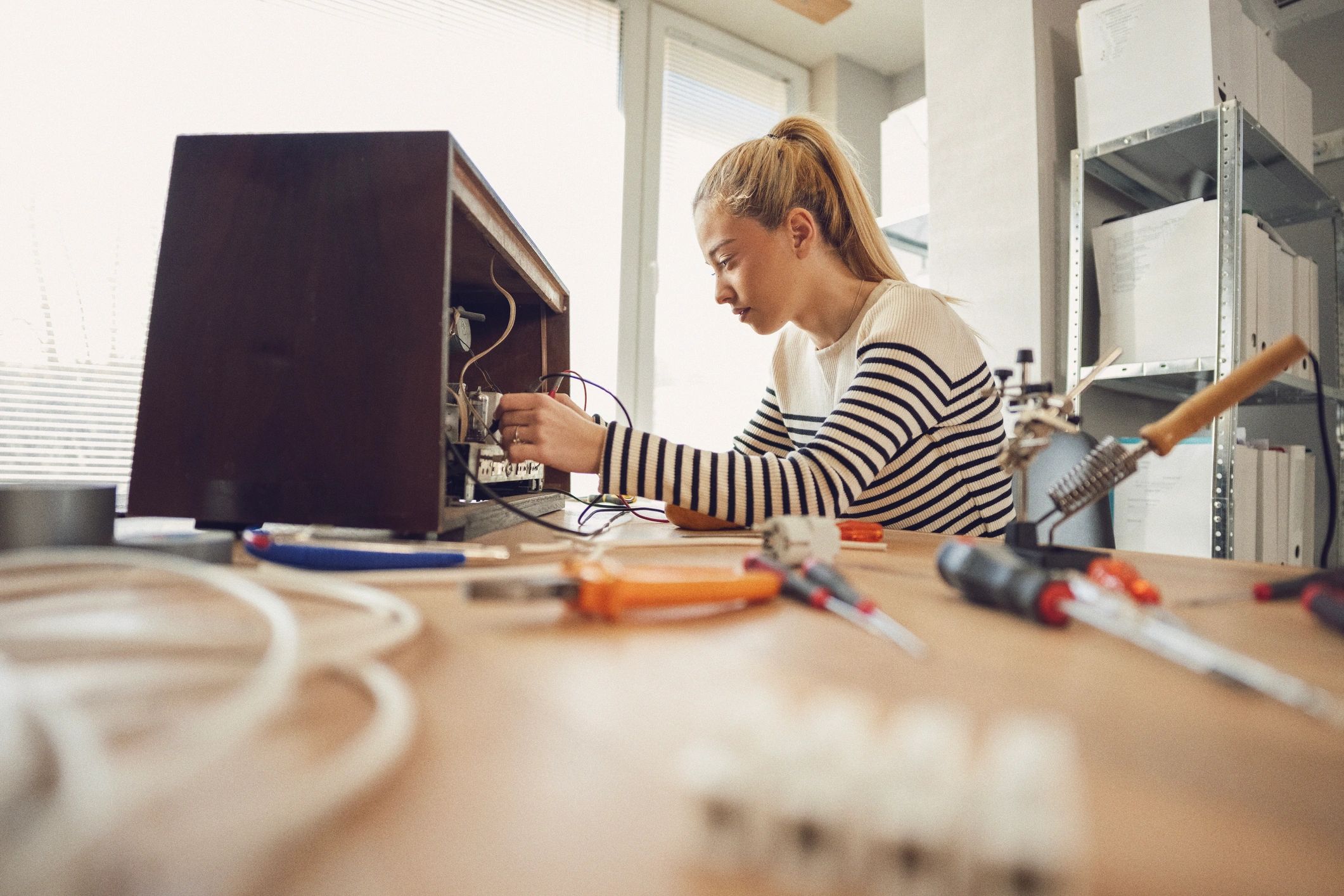 Technician working on computer electronics