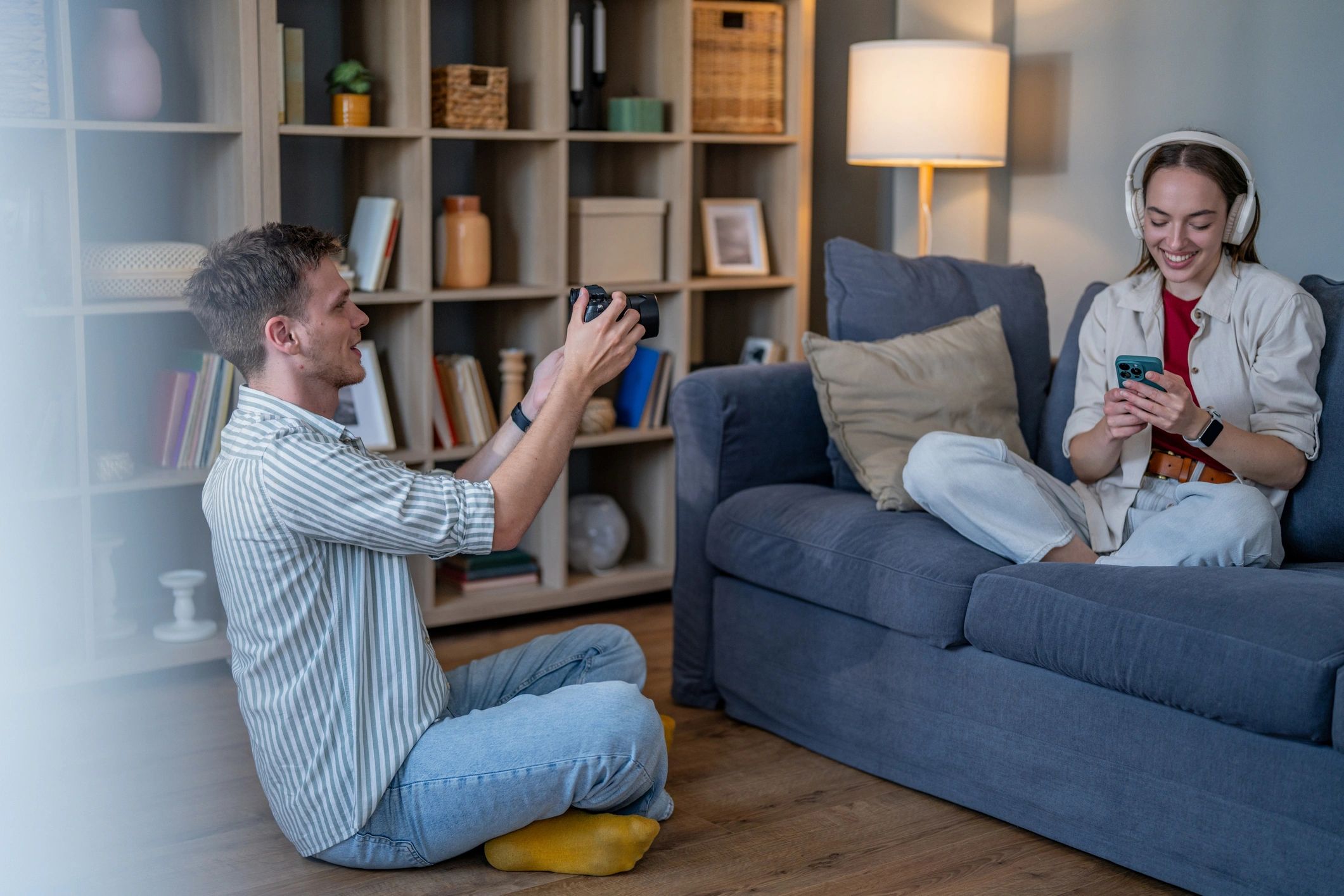 Homeowner using connected devices in living room